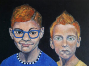 Jongens met rood haar en blauwe bril